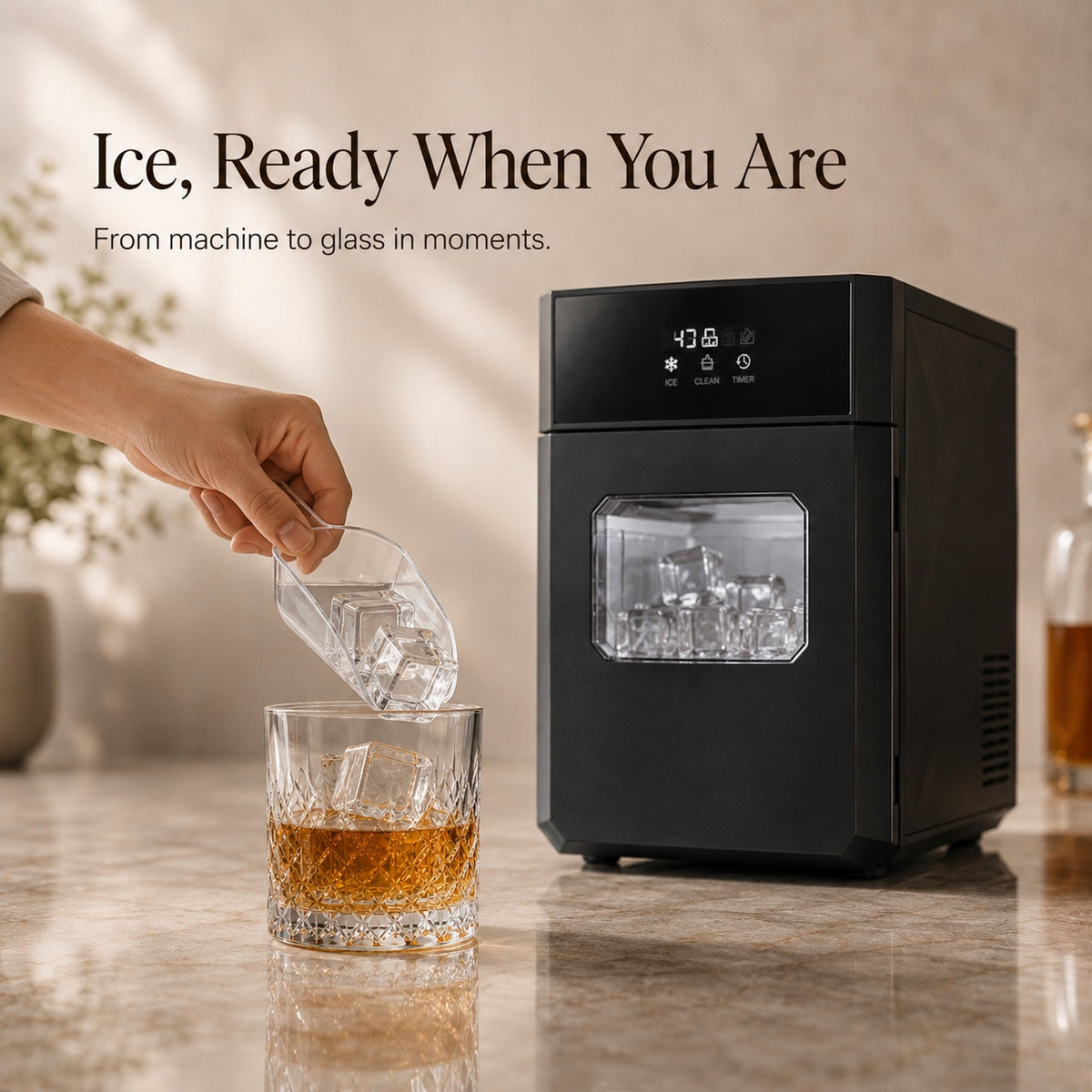 Serving large clear square ice from CrystalMax into a whiskey glass